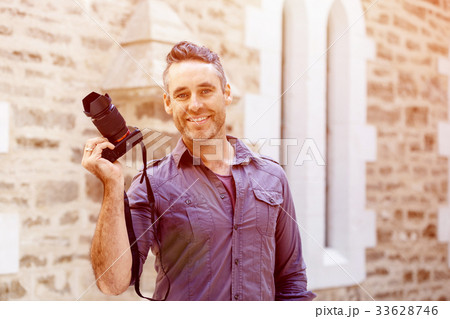 Male photographer taking picture Male photographer taking picture 33628746