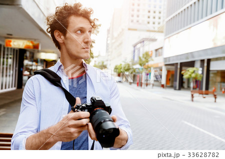 Male photographer taking picture Male photographer taking picture 33628782