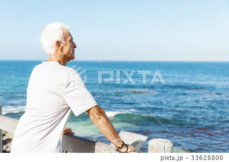 Man standing on beach in sports wear 33628800
