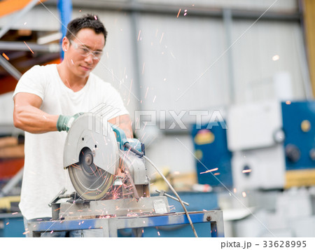 Asian worker in production plant on the factory floor 33628995