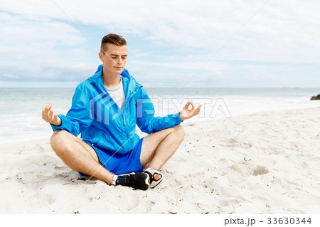 Man training on beach outside Man training on beach outside 33630344