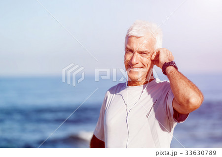 Sports and music. man getting ready for jogging Sports and music. man getting ready for jogging 33630789