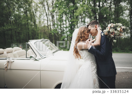 Happy bride and groom posing after wedding 33635124