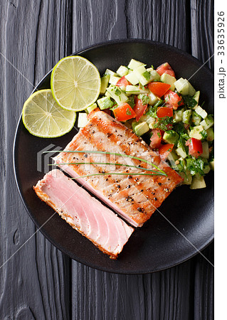 Mexican tuna steak with avocado cucumber salsa 33635926
