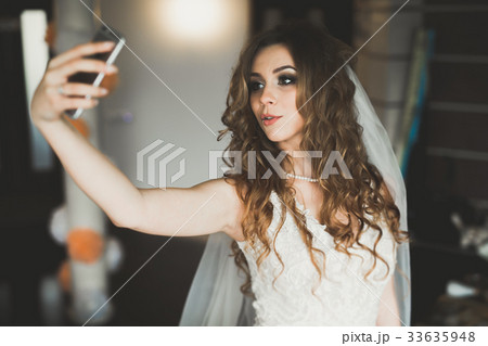 Beautiful bride making selfie in the home before 33635948