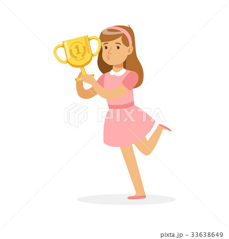 Happy school girl in pink dress holding winner cup 33638649