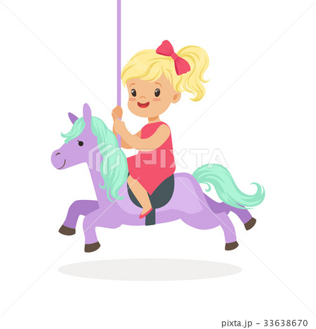 Cute little blonde girl riding on the carousel 33638670