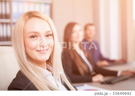 Beautiful blonde businesswoman in the office in 33640692