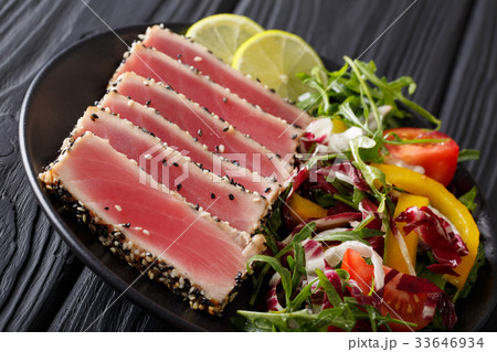 Delicious Tuna Steak in sesame, lime and salad 33646934