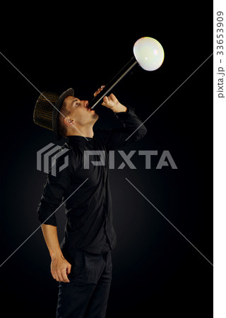 Man artist blowing many soap bubble. 33653909
