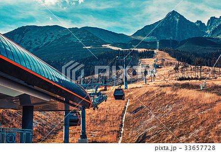 Cableway in mountains 33657728