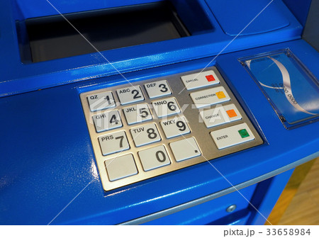 Blue color ATM machine and white button keypad. Blue color ATM machine and white button keypad. 33658984