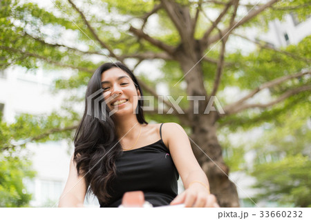 A portrait of a beautiful asian woman smiling A portrait of a beautiful asian woman smiling 33660232