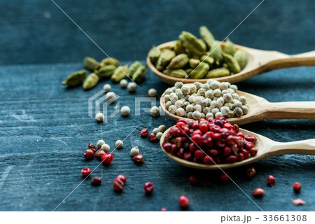 Close up three wooden spoons with colorful spices Close up three wooden spoons with colorful spices 33661308