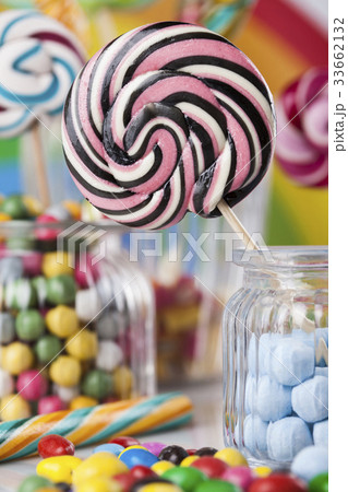 Colorful candies in jars on table on gum balls 33662132