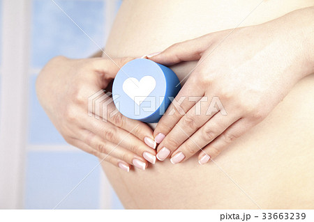 Pregnant woman loving heart her baby 33663239