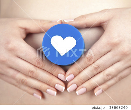 Pregnant woman loving heart her baby 33663240