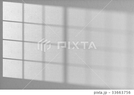 White wall with wallpaper and sunlight from window 33663756