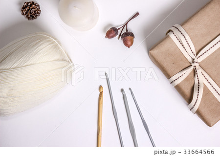 Crocheting supplies, hooks and white yarn 33664566