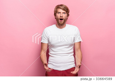 Portrait of young man with shocked facial Portrait of young man with shocked facial 33664589