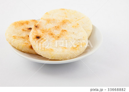 Roasted traditional Colombian white corn arepa Roasted traditional Colombian white corn arepa 33668882