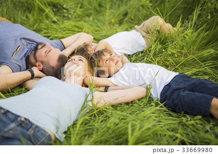 Happy family in the meadow Happy family in the meadow 33669980