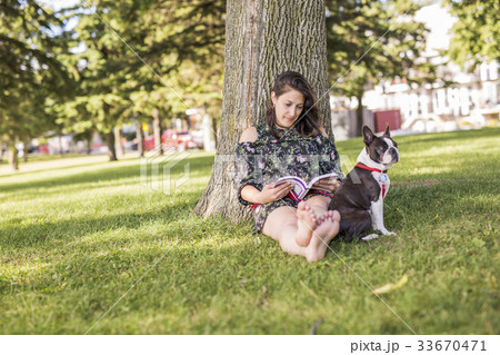 woman with terrier dog outside at the park woman with terrier dog outside at the park 33670471