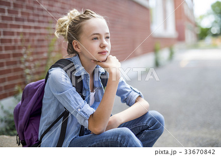 Nice Pre-teen boy outside at school having good 33670842