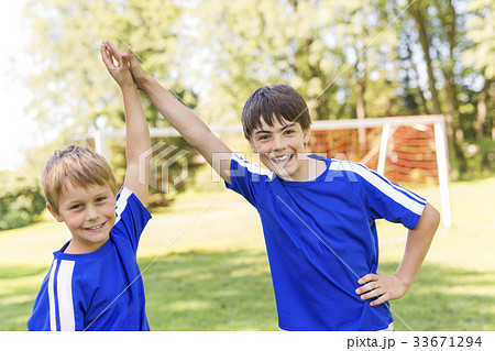 Two Young boy with soccer ball on a sport uniform 33671294