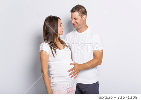 caucasian couple expecting baby smiling cheerful caucasian couple expecting baby smiling cheerful 33671308
