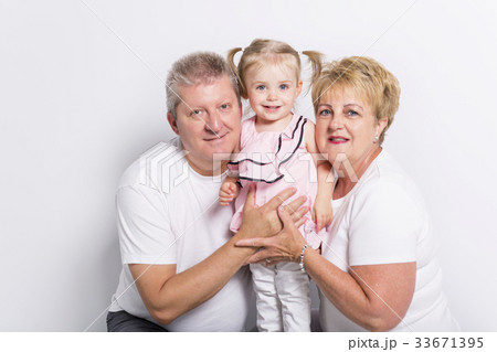 grandmother and geandfather with grandchild on 33671395