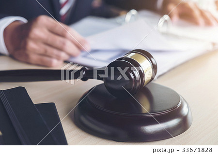 Close up of gavel, Male lawyer working with scales 33671828