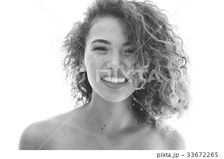 Portrait of a curly woman with freckles and naked 33672265