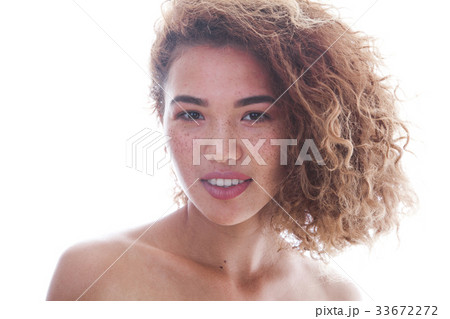 Portrait of a curly woman with freckles and naked Portrait of a curly woman with freckles and naked 33672272