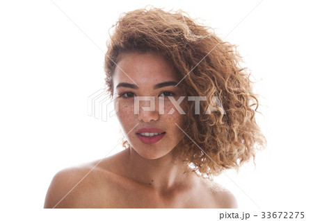 Portrait of a curly woman with freckles and naked 33672275