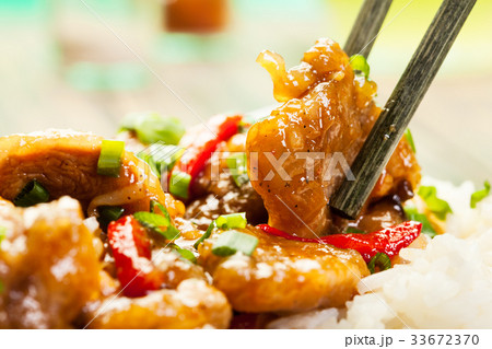 Sirloins on sweet and sour sauce served with rice Sirloins on sweet and sour sauce served with rice 33672370