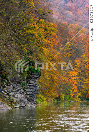 rocky cliff of mountain river background 33675217