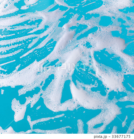 soap foam on a blue background 33677175