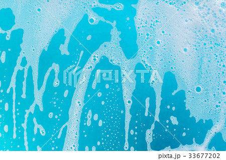 soap foam on a blue background 33677202
