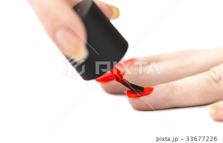 nail painting with red lacquer 33677226
