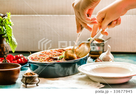Ratatouille in a crockery on blue rustic, serving 33677945