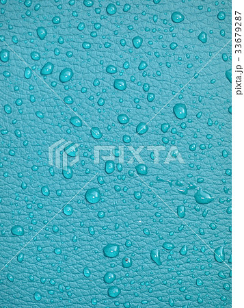 clean clear raindrops on bright blue green leather 33679287