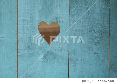 Heart in a wooden blue background. 33682560