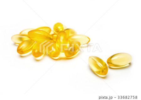 close up golden color fish oil in soft gel capsule 33682758