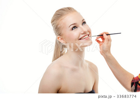 Make-up artist apply nude lipstick 33683774