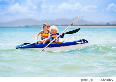 Kids kayaking in ocean. Children in kayak in sea 33684065