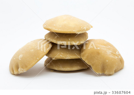 Hard palm sugar on white background 33687604