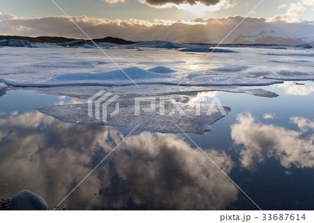 Beautiful reflection sky over winter lagoon Beautiful reflection sky over winter lagoon 33687614
