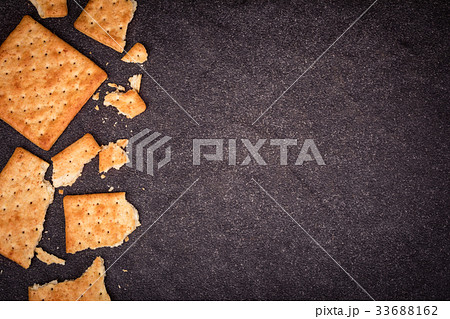 whole wheat crackers flat lay as border on black whole wheat crackers flat lay as border on black 33688162