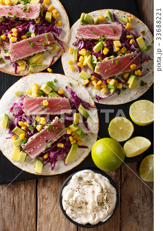 Mexican tacos with tuna, cabbage, corn, avocado 33688221